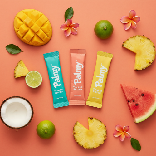 Palmy Tropical Drink Sticks flat lay with tropical fruits